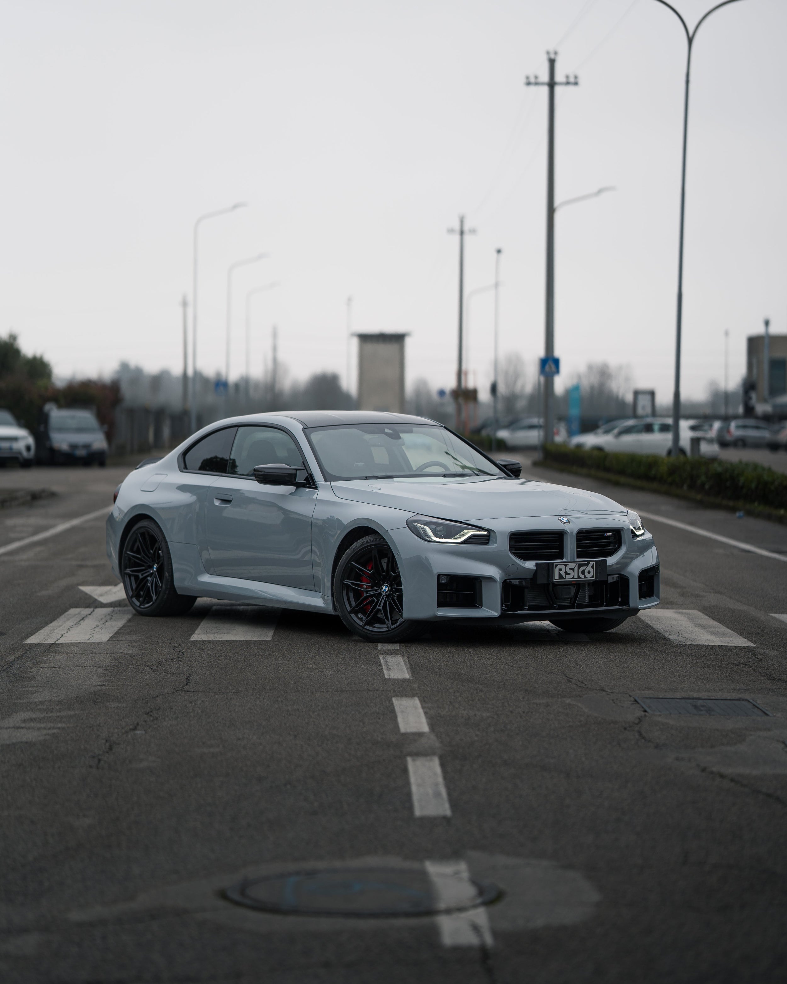 BMW M2 G87 with carbon fiber body kit by RSI c6: fender, mirror caps, front lip, ducktail spoiler rear extractor diffuser 