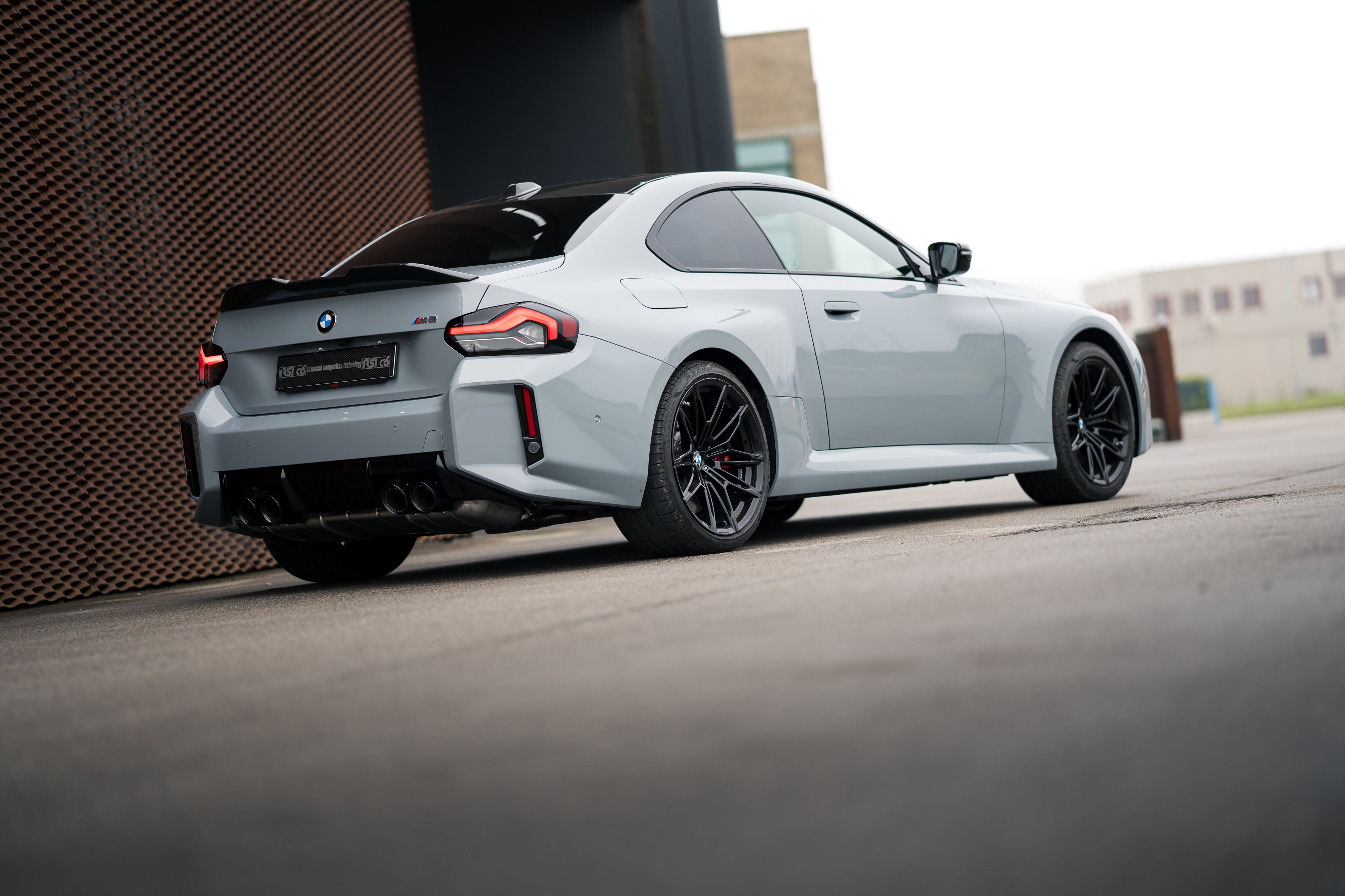 BMW M2 G87 with carbon fiber body kit by RSI c6: fender, mirror caps, front lip, ducktail spoiler rear extractor diffuser 