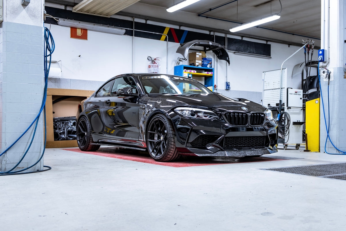 BMW M2 and M2 competition F87 with forged carbon fiber body kit by RSI c6: fender, mirror caps, front lip, ducktail spoiler rear extractor diffuser 