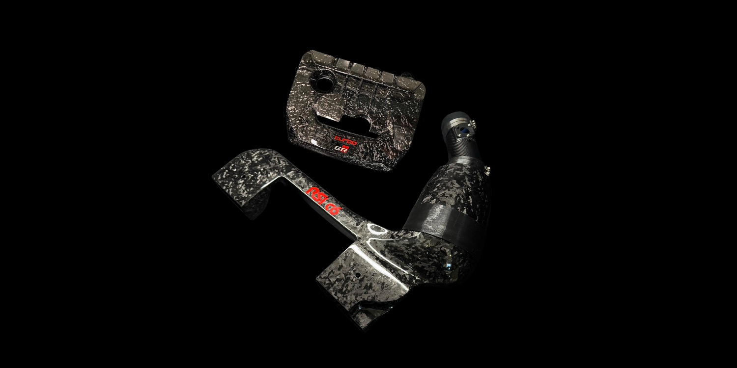 Carbon fiber engine intake system handcrafted in Italy for improved airflow and performance