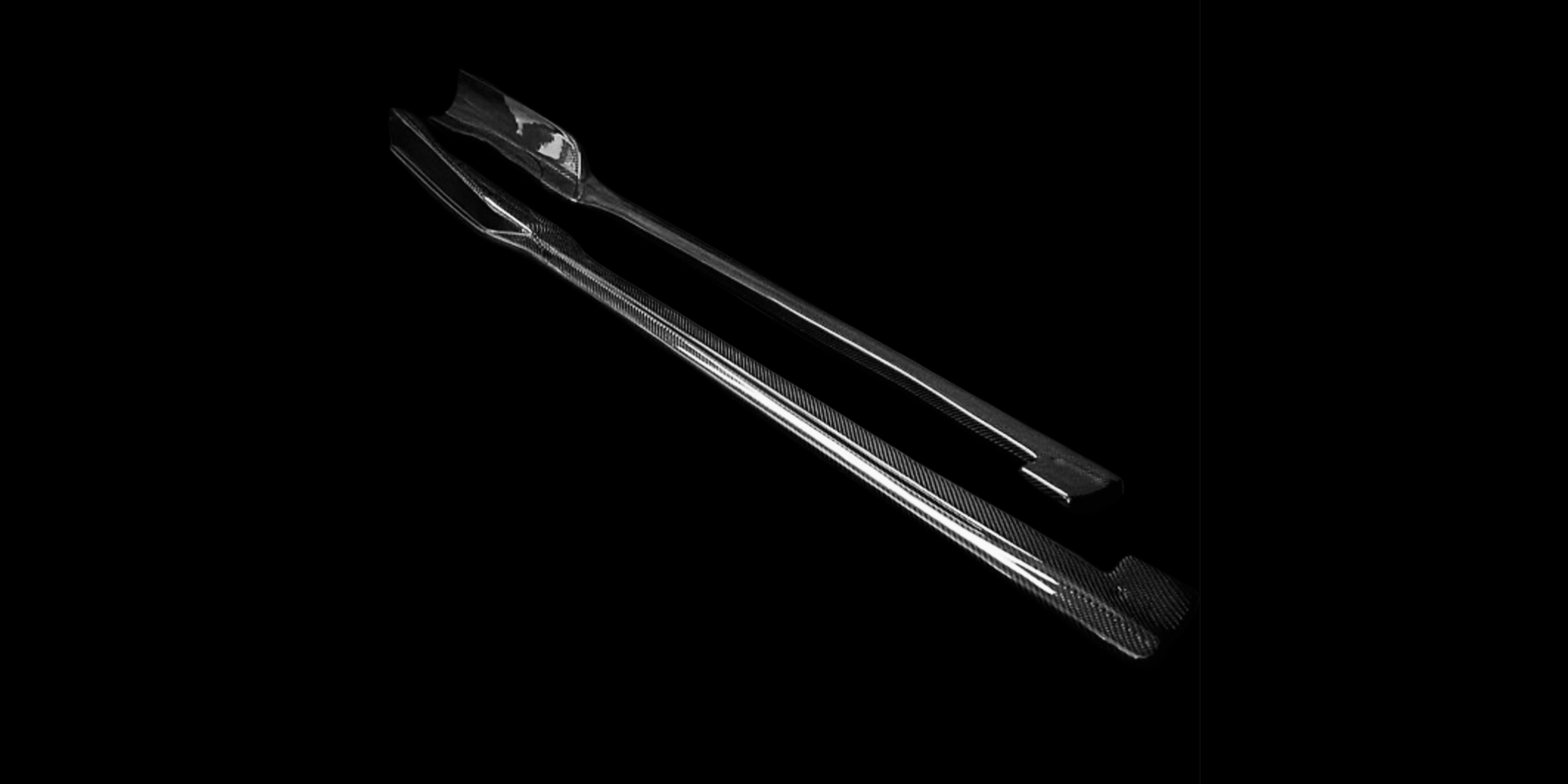 Carbon fiber side skirts made in Italy for aerodynamic balance and styling