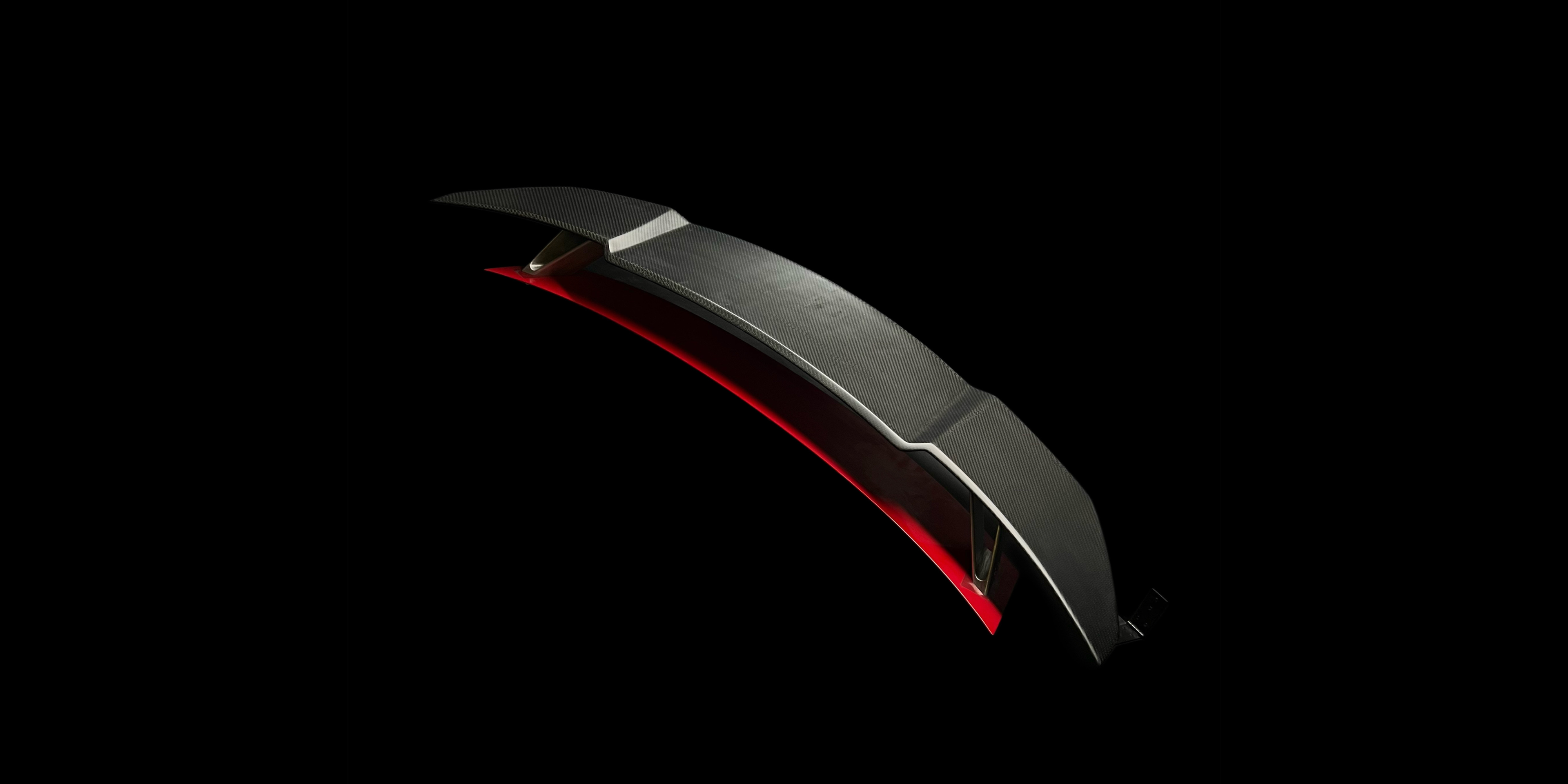 Carbon fiber rear spoiler made in Italy for aerodynamic performance and racing aesthetics