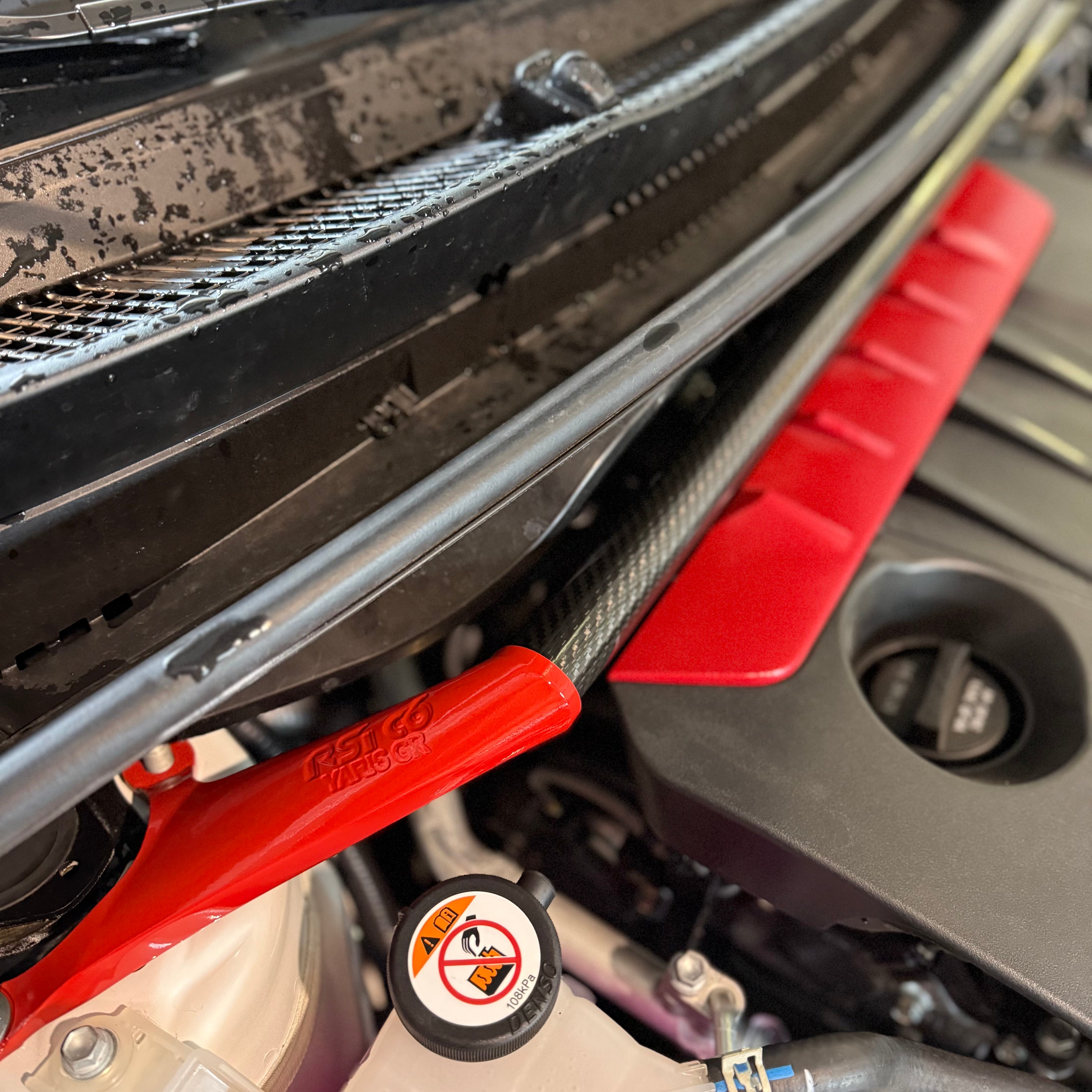 Front Strut Bar in Gloss Carbon Fiber and red alluminium for Toyota GR Yaris mk2 by RSI c6